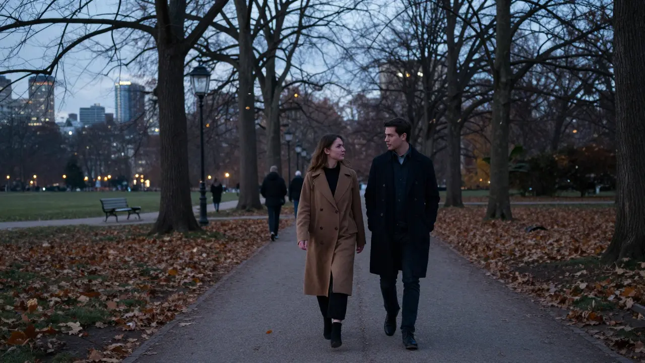 A man and woman walking peacefully through Tiergarten park at dusk, autumn leaves falling around them.