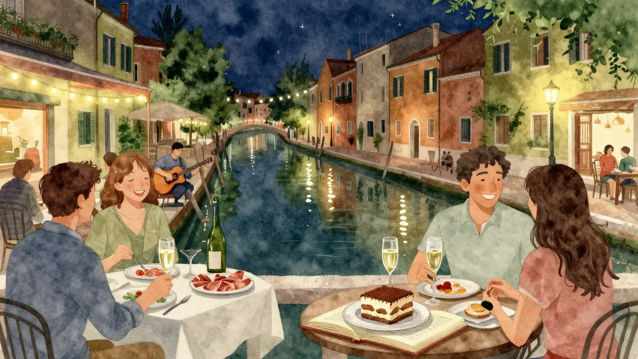 Couples and friends enjoying drinks by canal-side terraces under string lights with a guitarist playing at night.